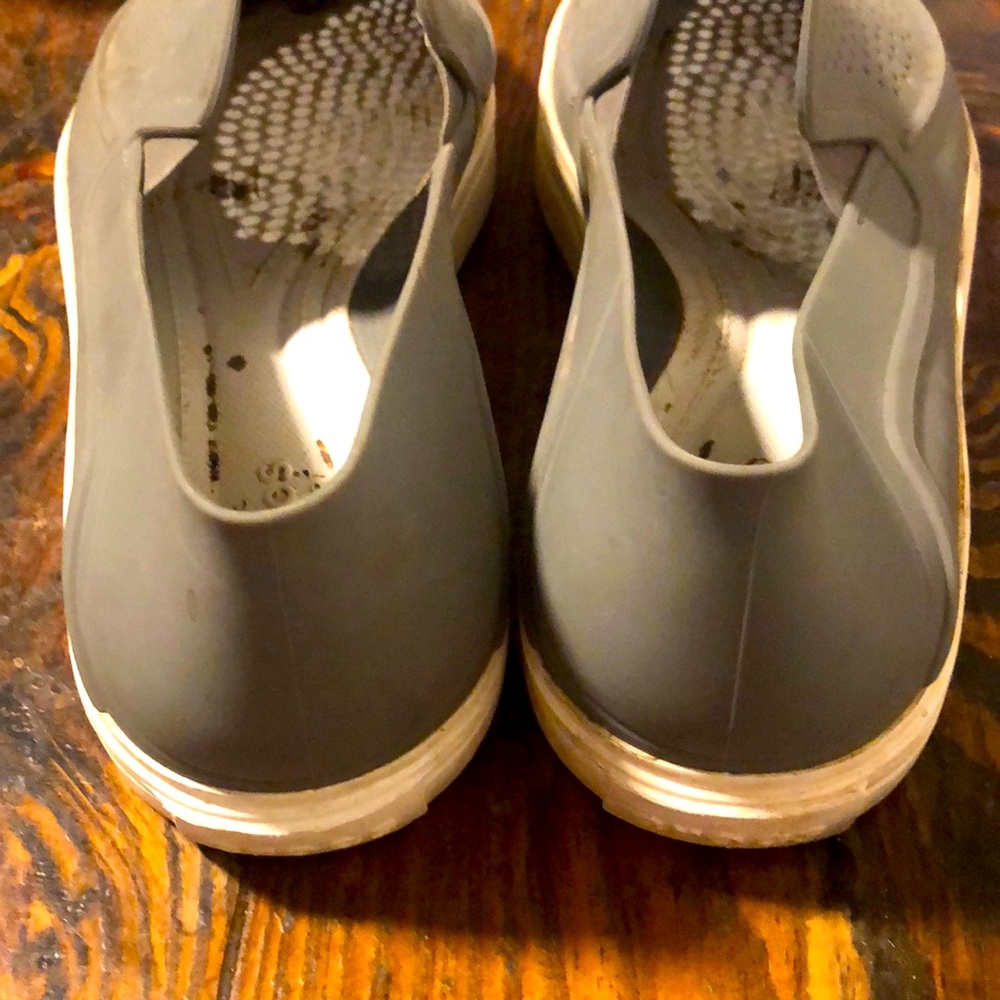 Gray crocs slip on water shoes.